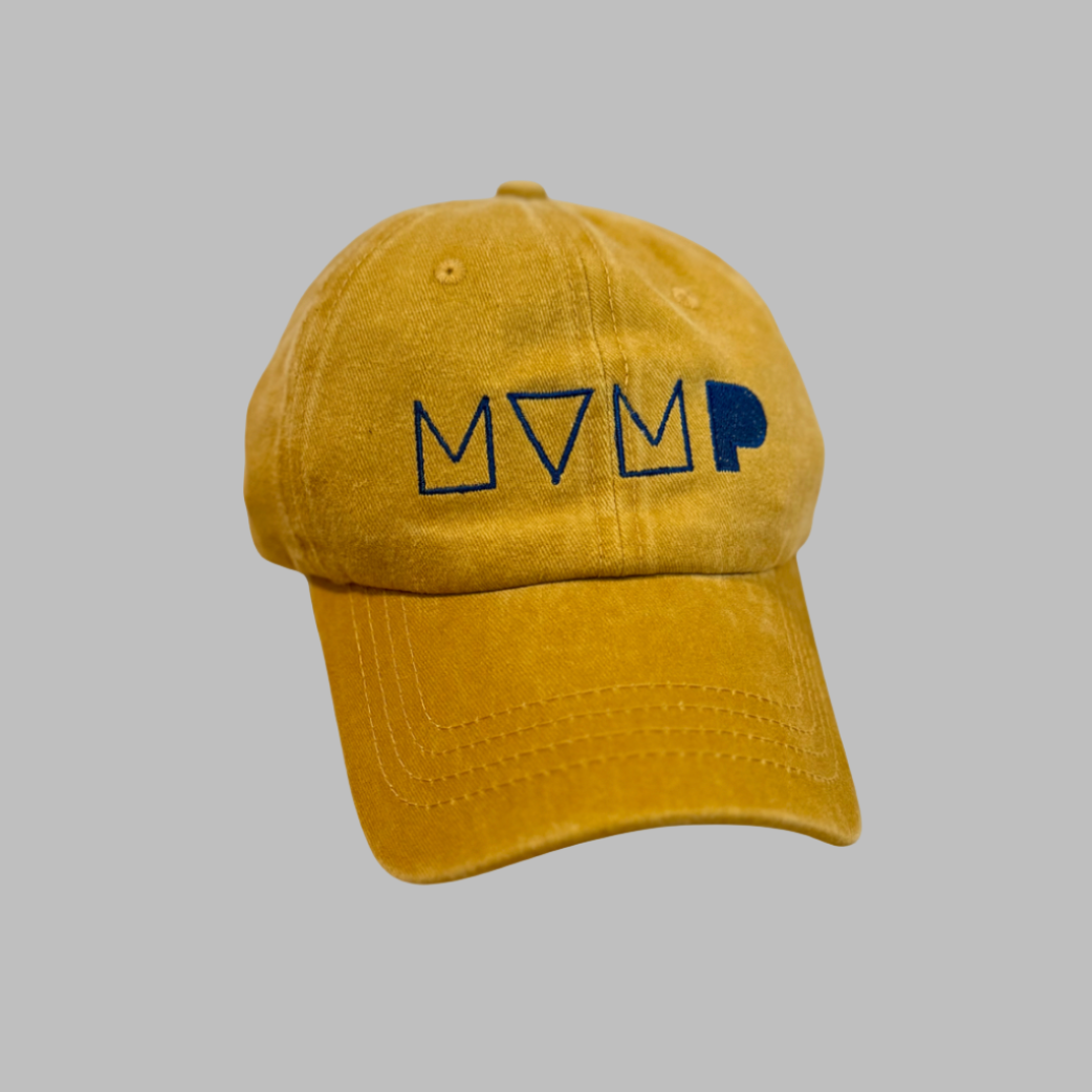 Yellow cap with MVMP logo on a gray background