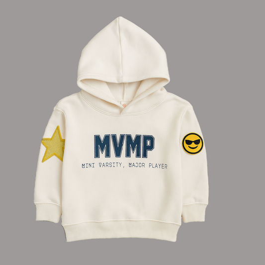 Cream hoodie with 'MVMP' text and sleeve patches on a gray background