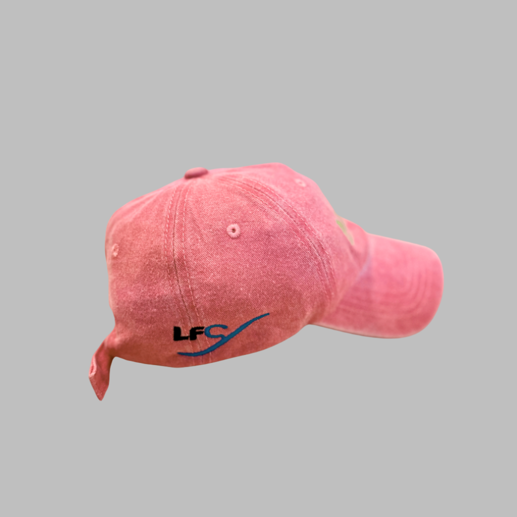 Pink cap with a logo on a gray background